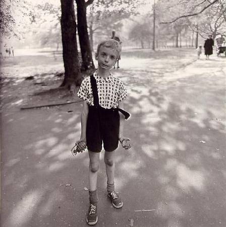 Child with hand grenadedia near bus,1962