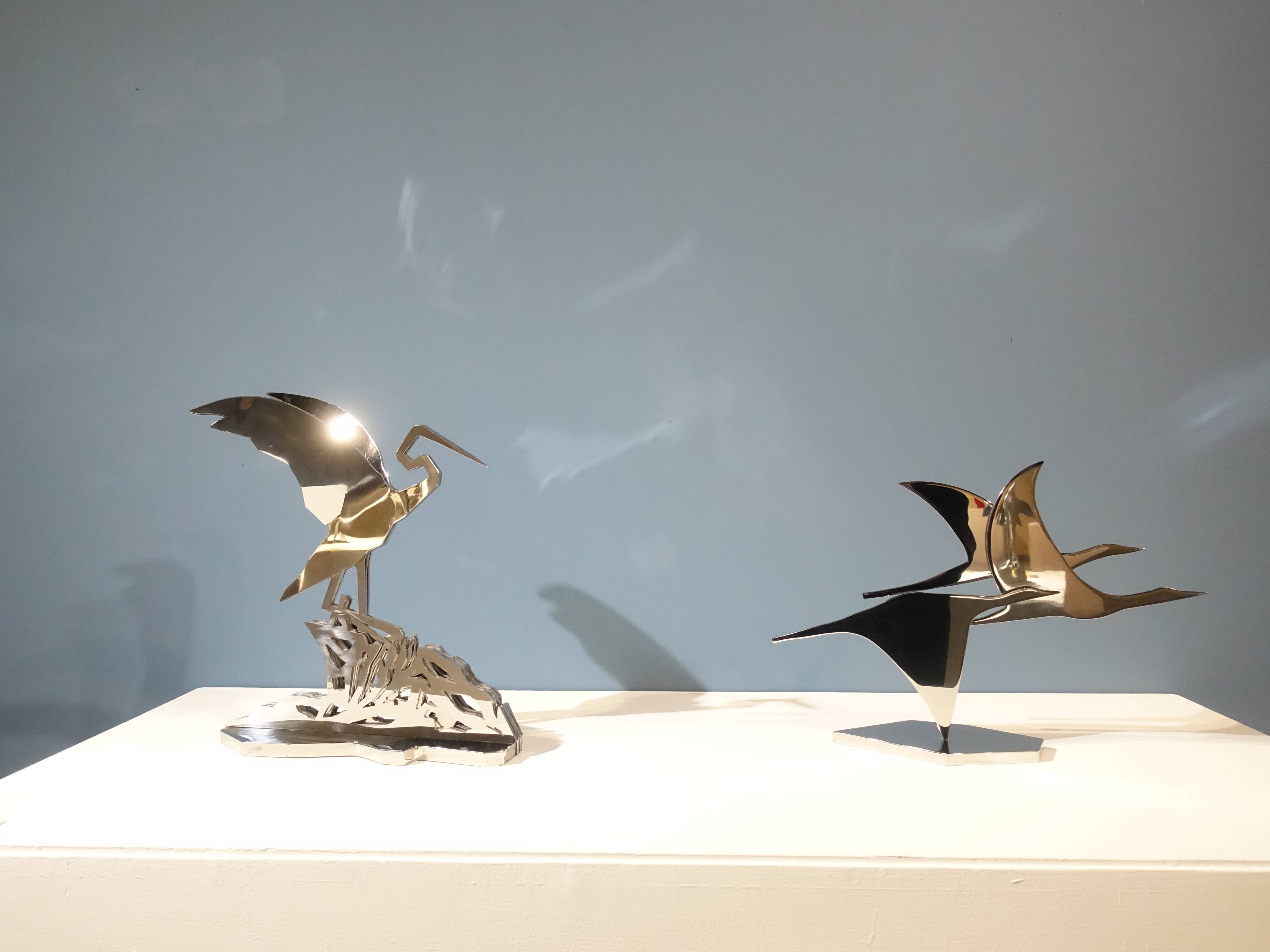 蒲浩明，《歇與飛》，44 X 38 X 15 cm，不鏽鋼，2002(左)。《翱翔》，50 X 36 X 15 cm，不鏽鋼，2012。